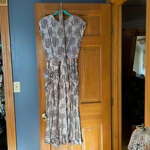 Grey/silver imprinted grey flowers Swoop hem shorter in front, open back size 7